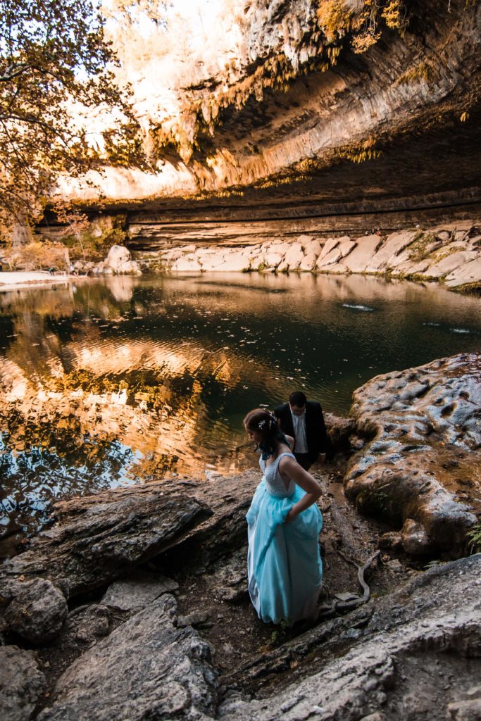 Couple exploring Hamilton Pool on their elopement day