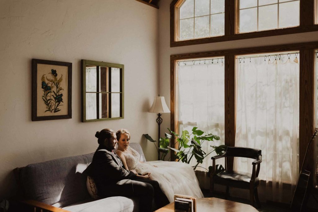 Couple getting ready in their Airbnb before their Llano River Elopement