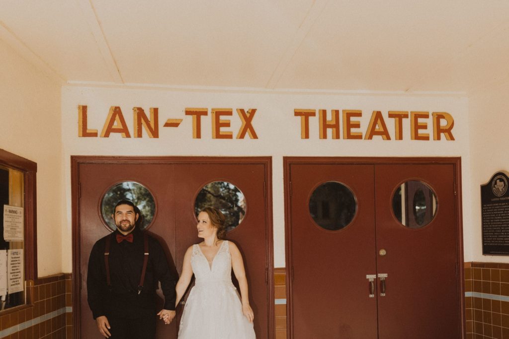 Couple visiting the Llano Theater during their Llano River Elopement