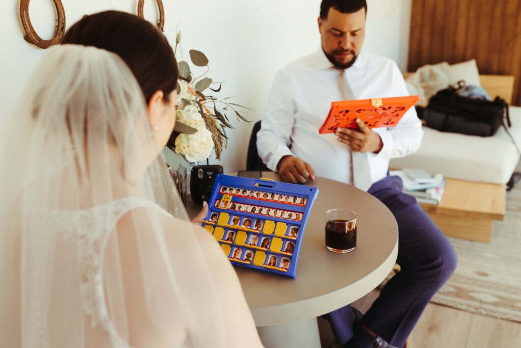 Couple playing a board game on their elopement day