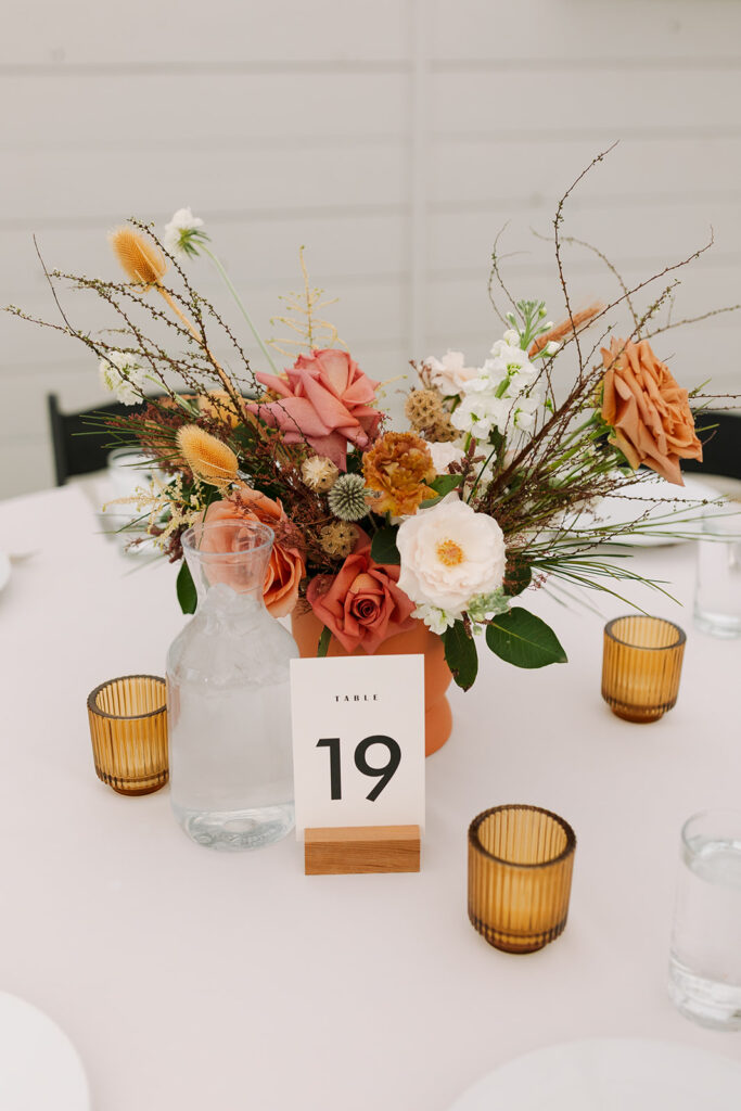 wedding table setting with floral and candle decor