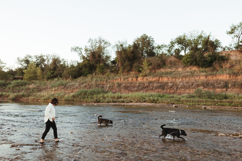 bride walks dogs at Inks Lake in Texas
