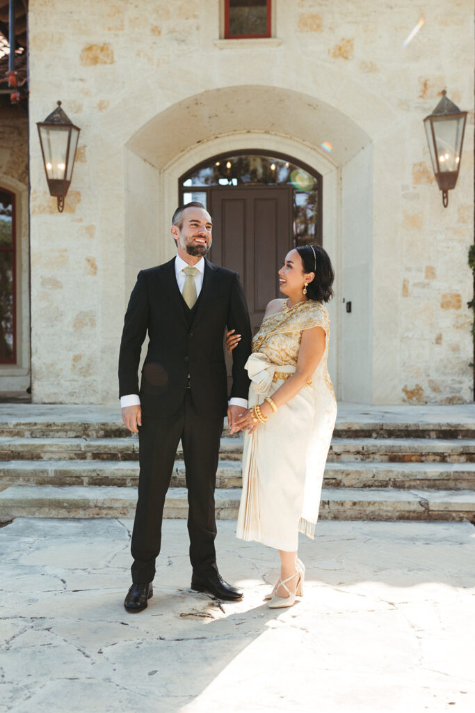 couple stands in front of Garey House wedding venue