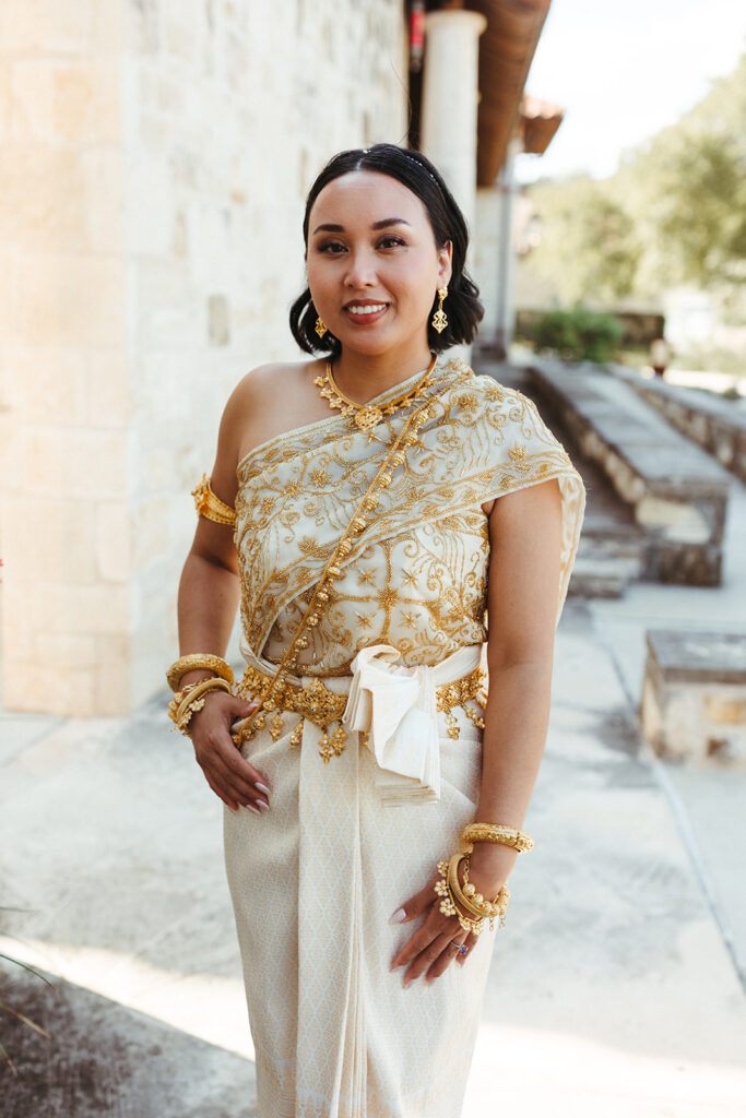 bride wears traditional cultural wedding dress and jewelry