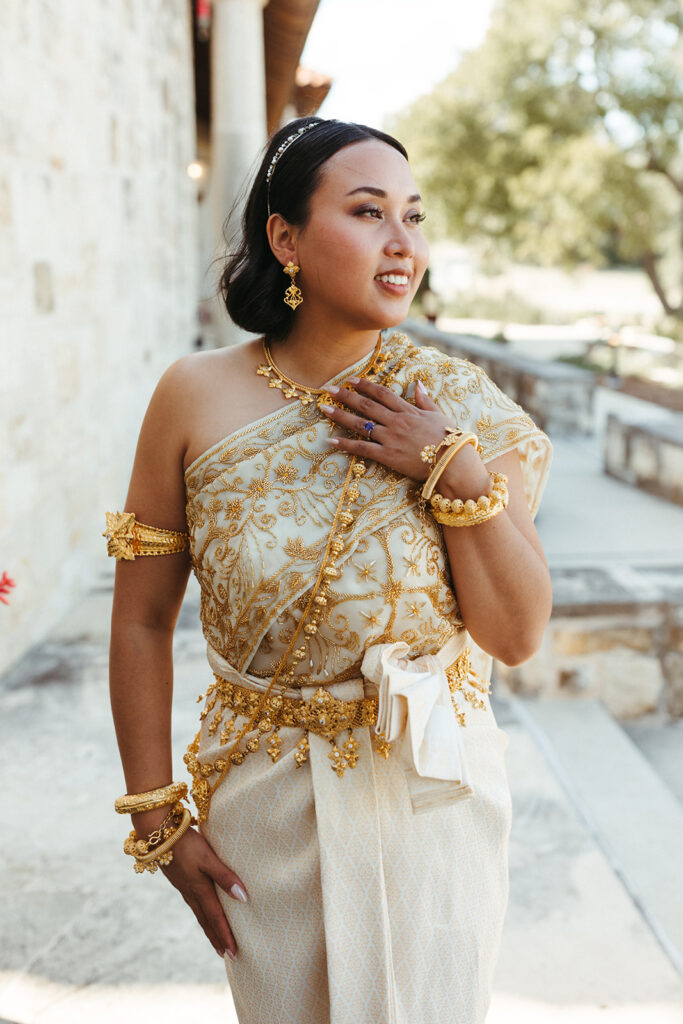 bride wears traditional cultural wedding dress and jewelry