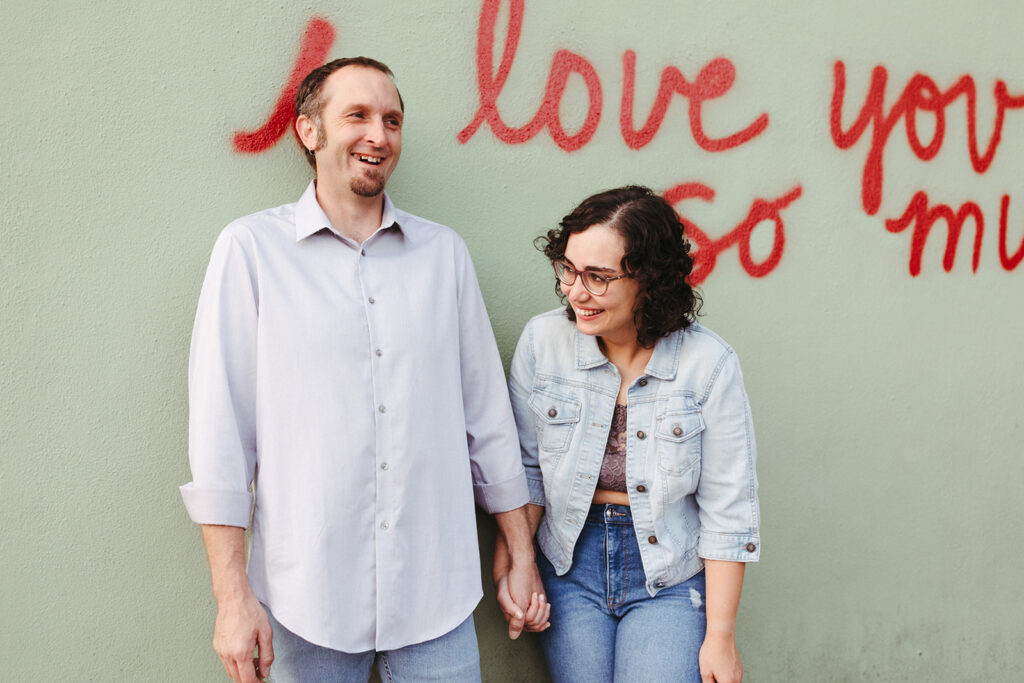 Austin engagement photographer captures couple in front of Austin I love you so much mural