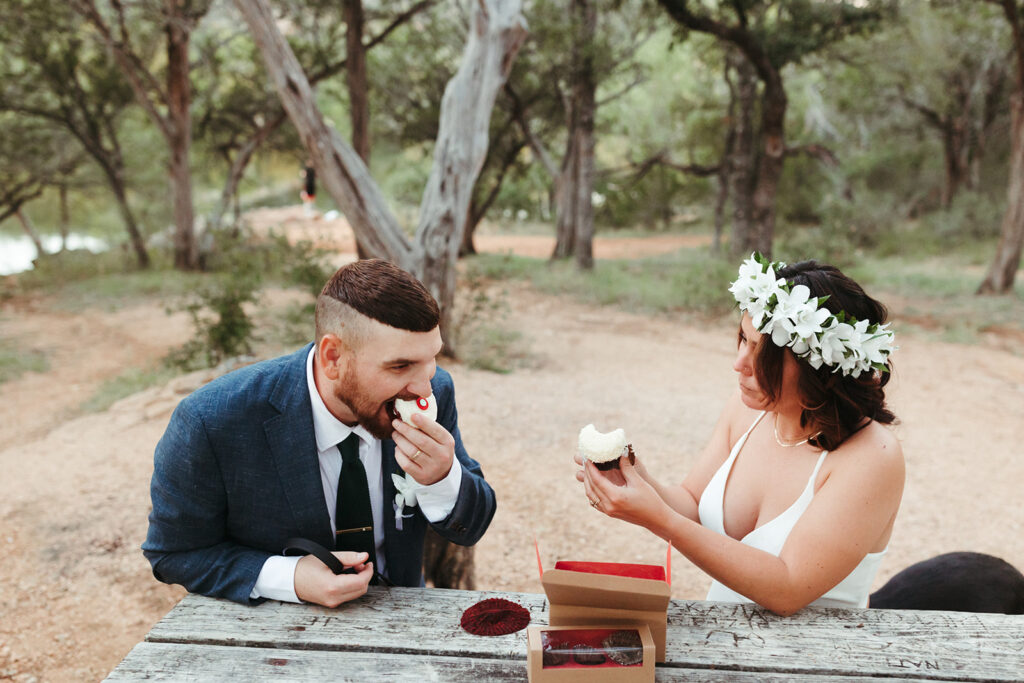 couple eats cupcakes during elopement