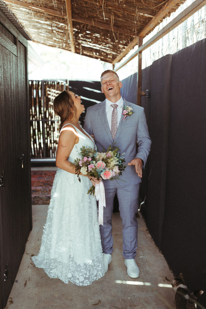 couple laughs together at Texas Hill Country wedding