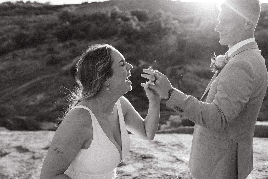couple holds hands at Texas Hill Country wedding elopement