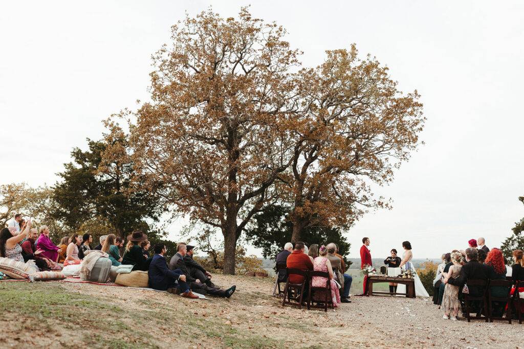 couple exchanges vows outdoor Texas wedding venue