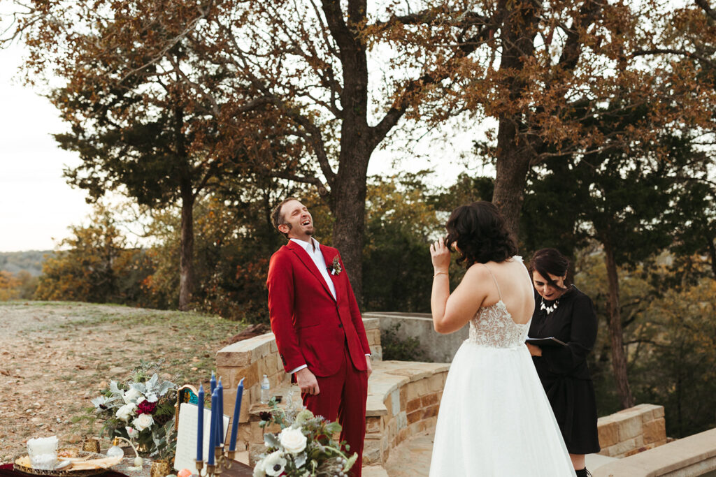 couple laughs during wedding ceremony