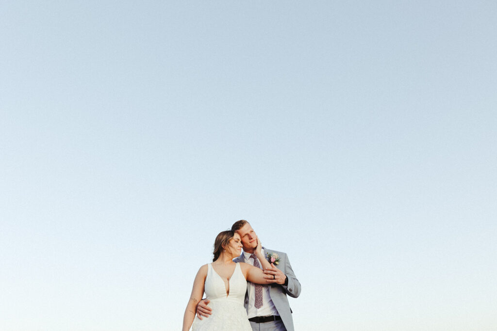 couple embraces at Texas Hill Country wedding elopement