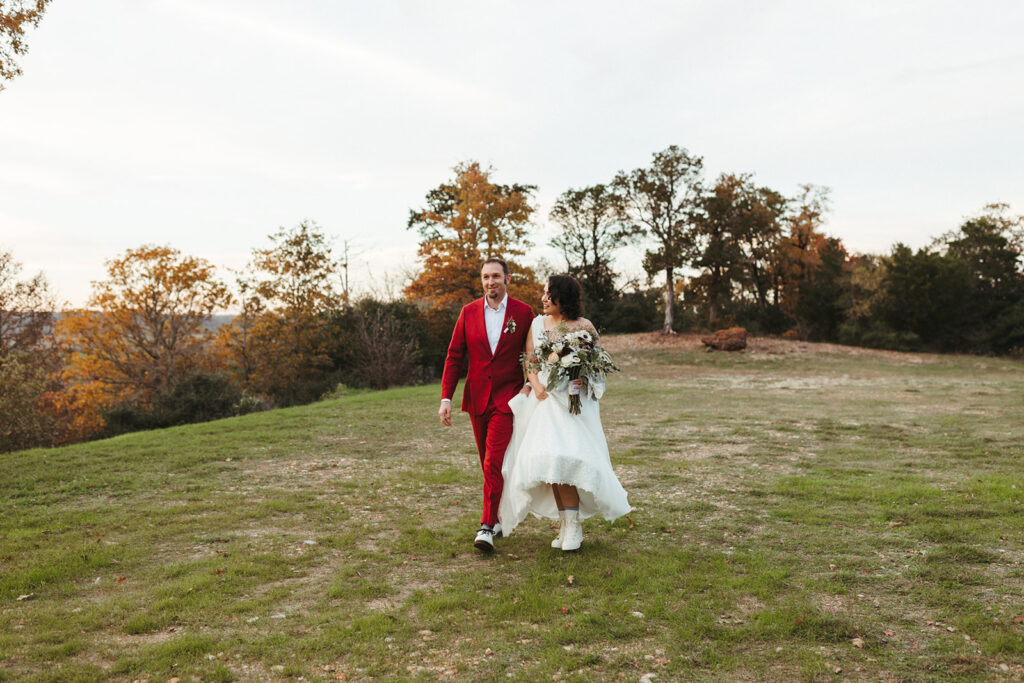 couple walks along grounds at Shiraz Garden wedding in Texas