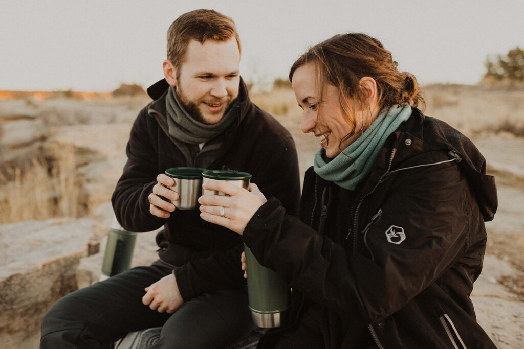 couple drinks coffee together using elopement ideas for sunrise elopement