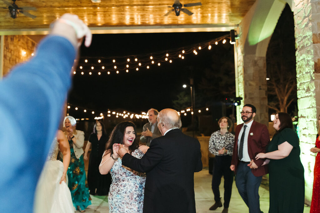 couple dances at outdoor wedding reception 