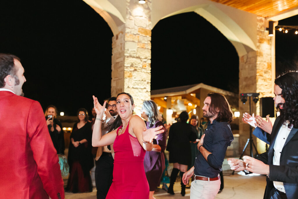 guests dance at outdoor wedding reception 