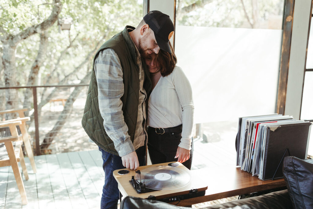 couple listens to personalized vinyl record on elopement day