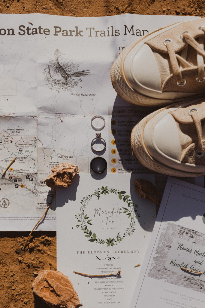 flat lay of wedding accessories and invitations 