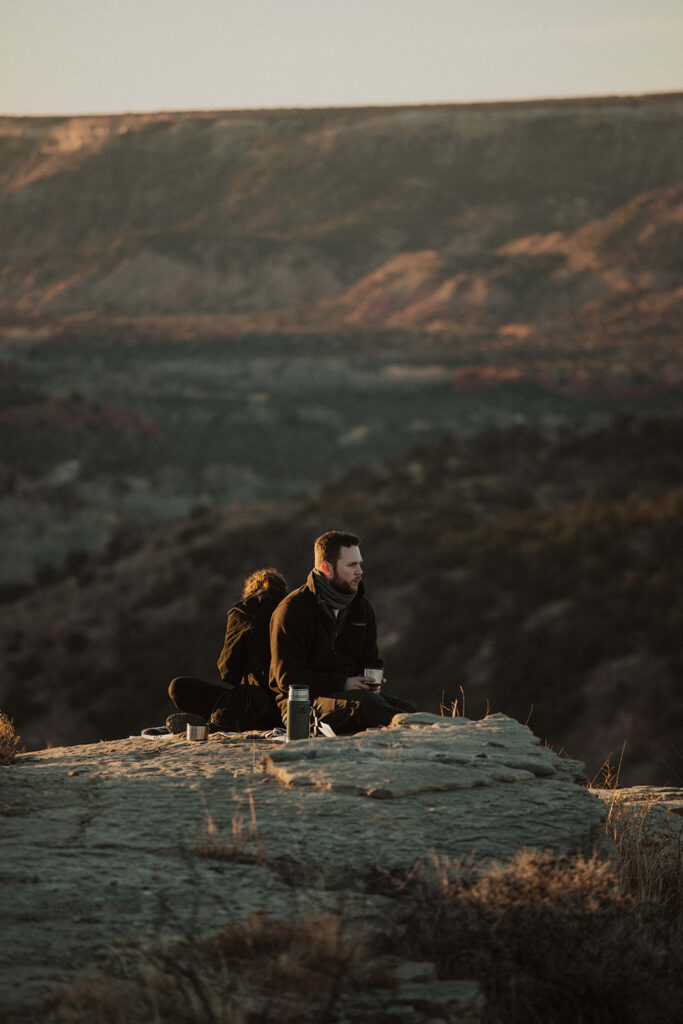 couple writes vows together at sunrise mountaintop elopement