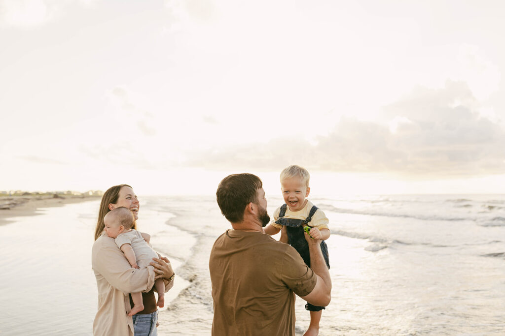Family at Galveston beach photographed by Galveston beach family photographer
