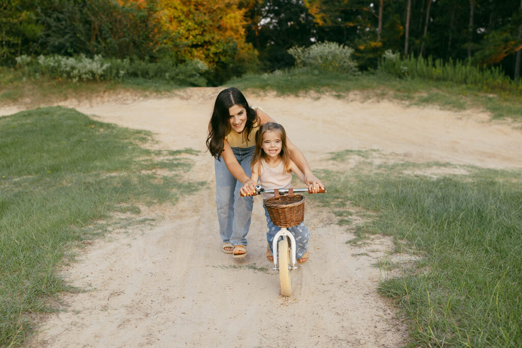 Family riding bikes during their family photo session in The Woodlands Texas