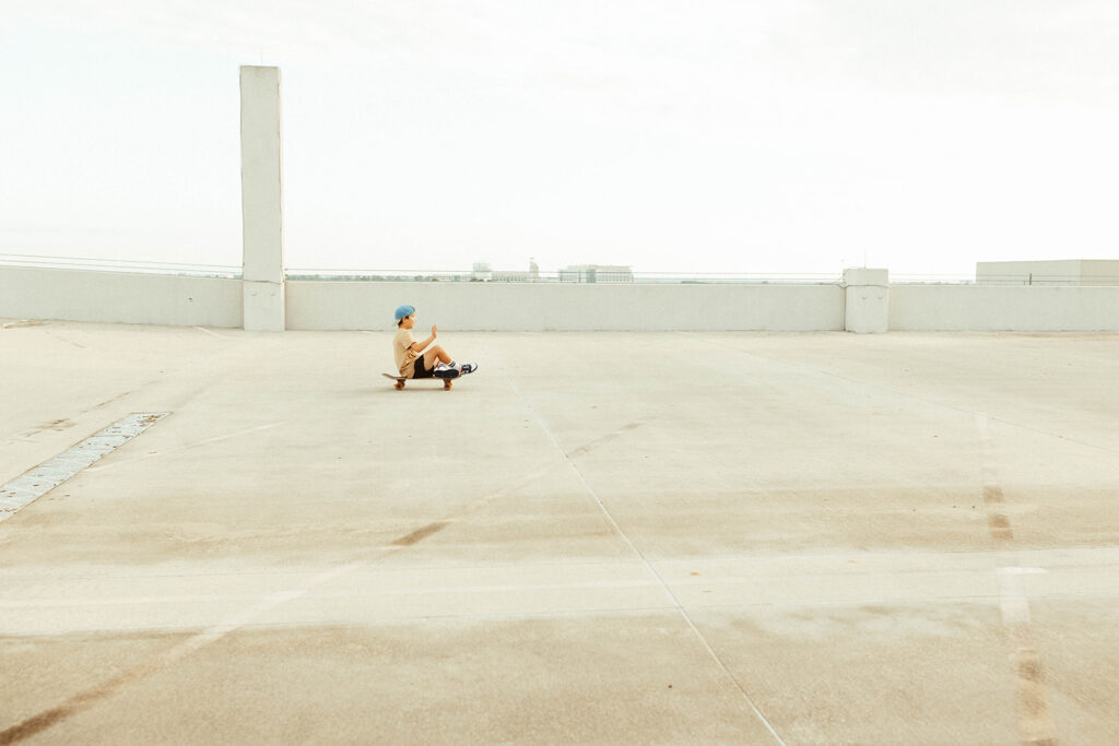 Skateboarding on a garage rooftop in The Woodlands Texas photographed by The Woodlands Texas family and lifestyle photographer